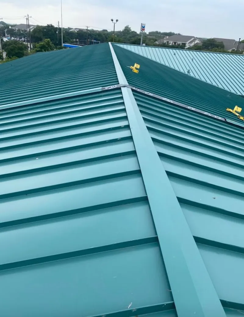 Green commercial metal roof ridge and valley for Metal Roof Repair in Hampstead