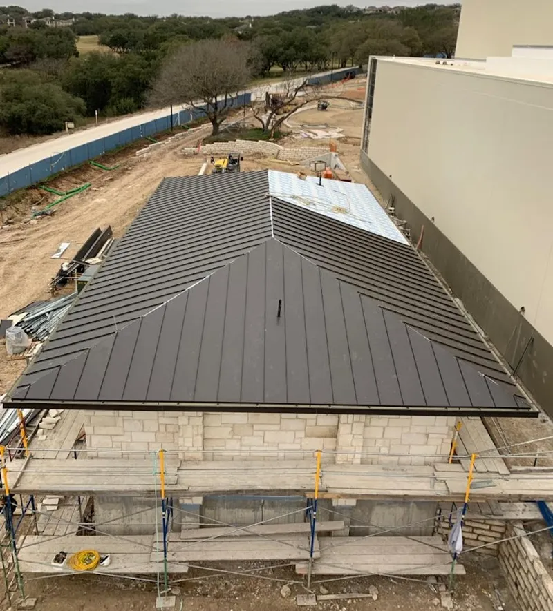 Metal roof new construction with scaffolding in Hampstead